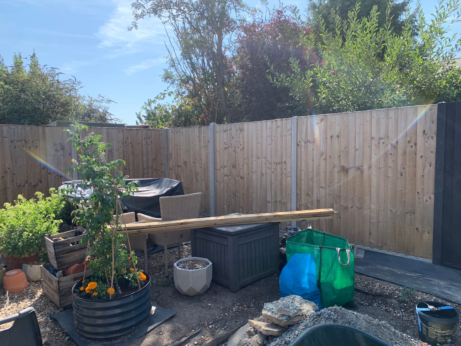 Garden fence in Saxmundham before and after painting from bare timber to black (before)