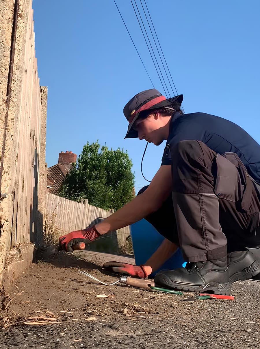 Mackenzie Taylor working in a garden in Suffolk